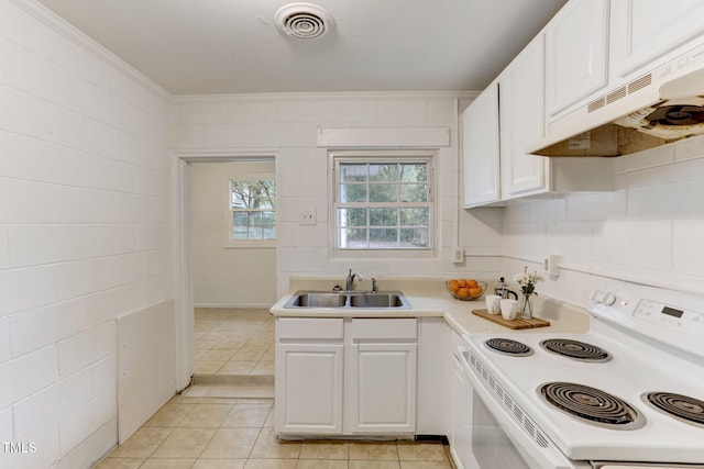 kitchen featuring white cabinetry, sink, ornamental molding, electric range, and light tile patterned floors