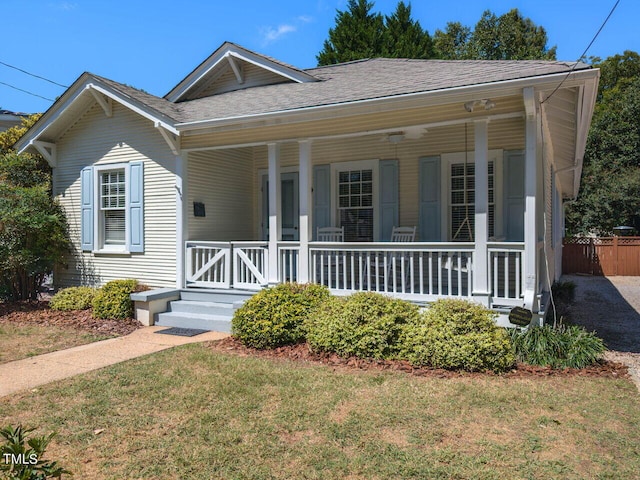 view of front of property featuring a porch and a front lawn