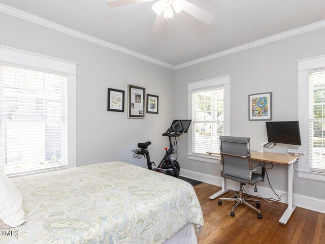 bedroom with wood-type flooring, ornamental molding, and ceiling fan