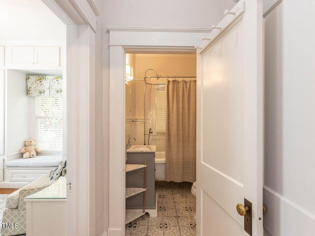 full bathroom featuring vanity, toilet, and shower / bathtub combination with curtain