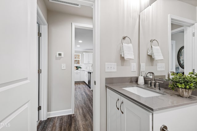 bathroom featuring hardwood / wood-style floors and vanity