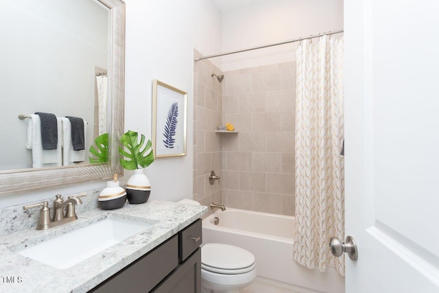 full bathroom featuring toilet, vanity, and shower / tub combo with curtain