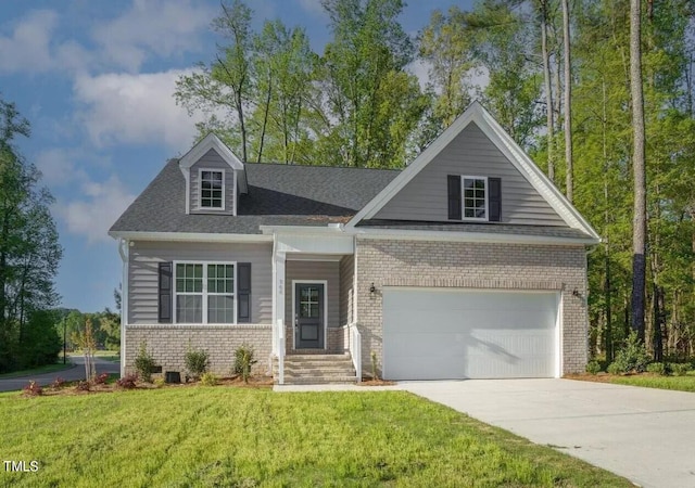 view of front of home featuring a front yard and a garage