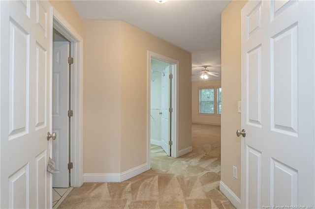 hallway with light carpet