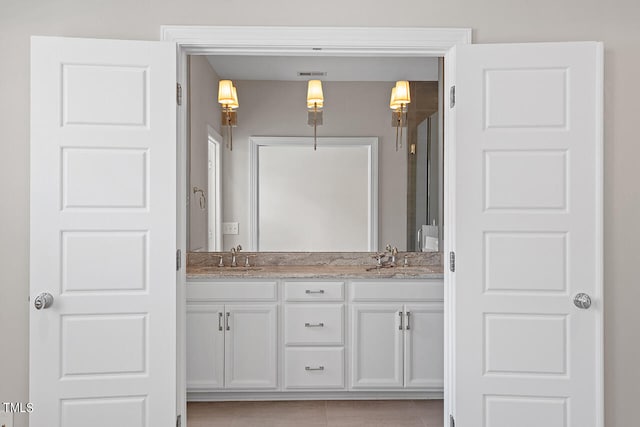 bathroom featuring vanity and tile patterned floors