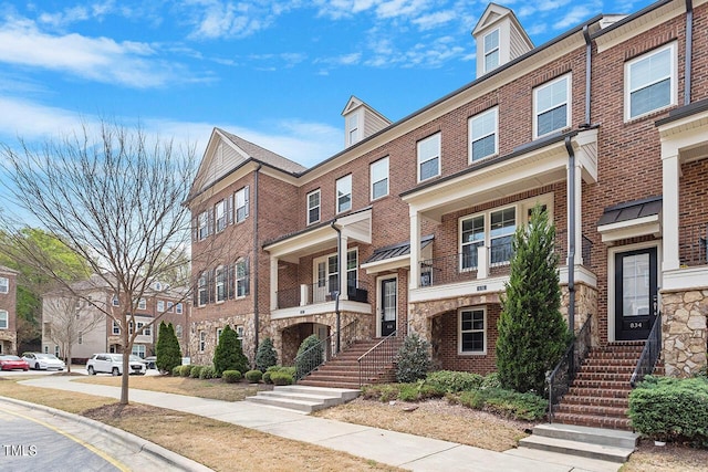 view of front of house with brick siding