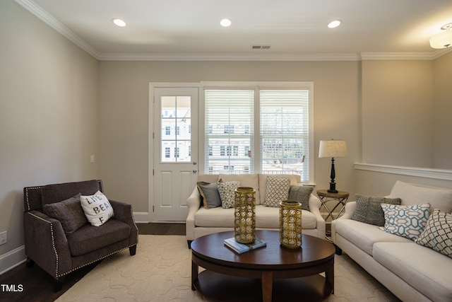 living room with baseboards, recessed lighting, wood finished floors, and ornamental molding