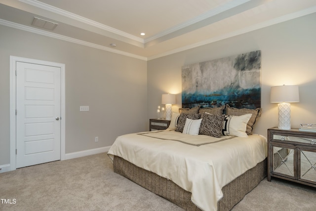 bedroom featuring visible vents, crown molding, baseboards, carpet floors, and a tray ceiling