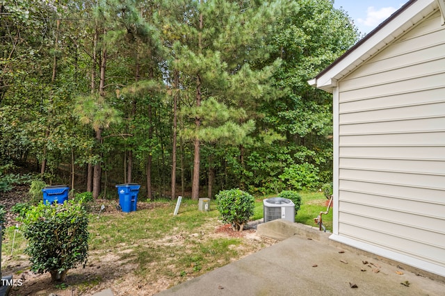 view of yard featuring a patio and central AC unit