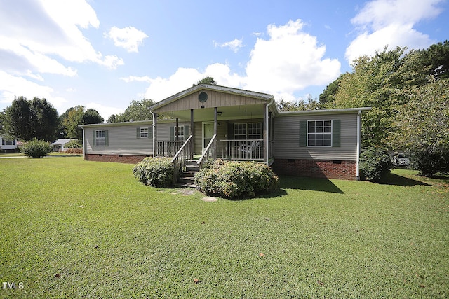 exterior space with covered porch and a front yard