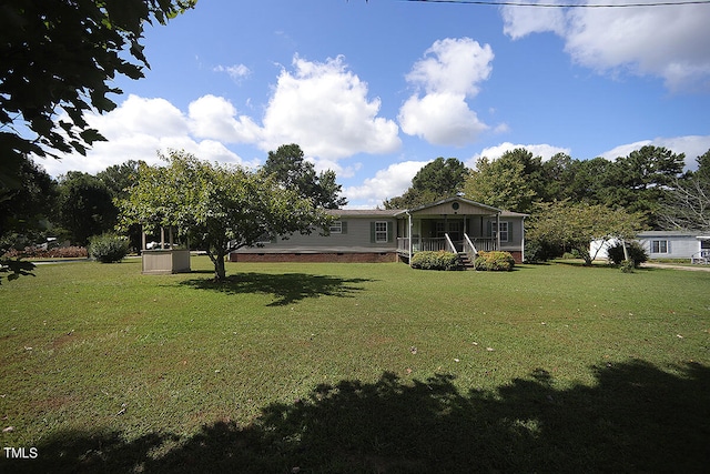 view of yard with covered porch