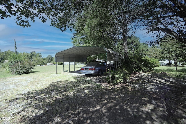 view of parking featuring a lawn and a carport