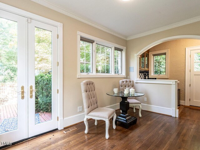 sitting room featuring ornamental molding, dark hardwood / wood-style floors, and french doors