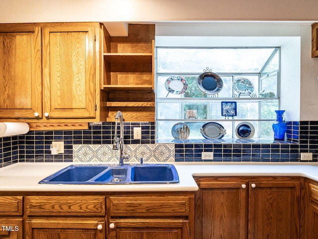 2501 Kenmore Dr, Raleigh, NC 27608 - kitchen with a sink, decorative backsplash, and light countertops