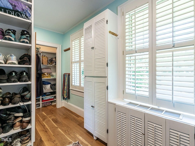 2501 Kenmore Dr, Raleigh, NC 27608 - walk in closet featuring light wood finished floors