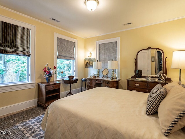 carpeted bedroom featuring crown molding