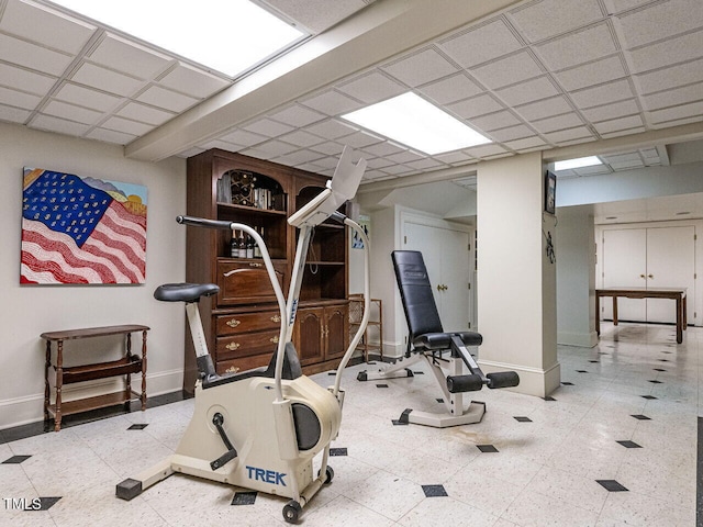 exercise room featuring a drop ceiling