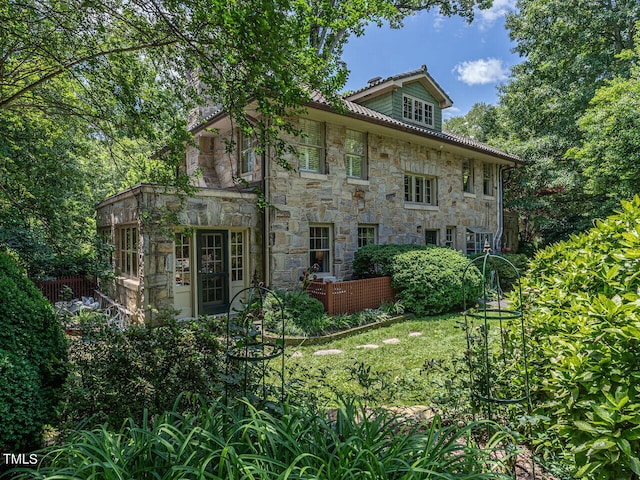 2501 Kenmore Dr, Raleigh, NC 27608 - rear view of property with stone siding