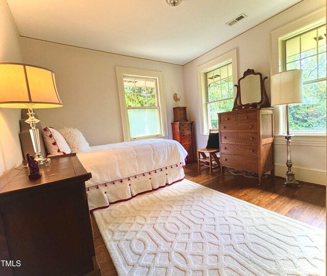 bedroom featuring dark hardwood / wood-style floors