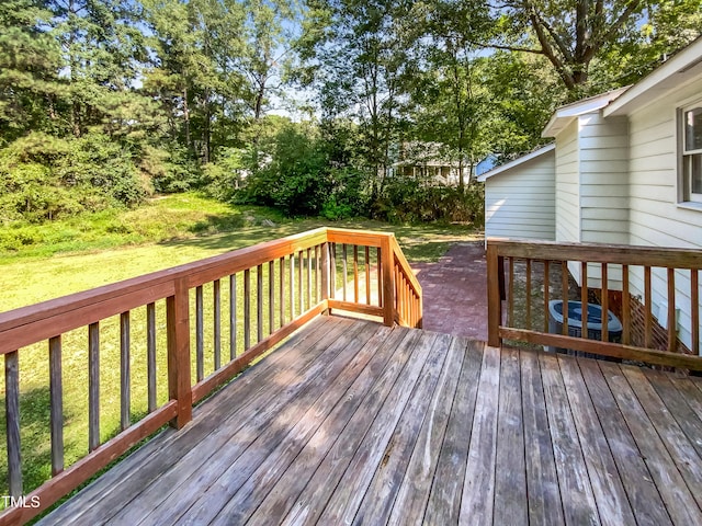 deck featuring a yard and central AC