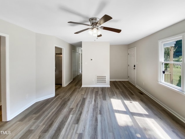 spare room with ceiling fan and wood-type flooring