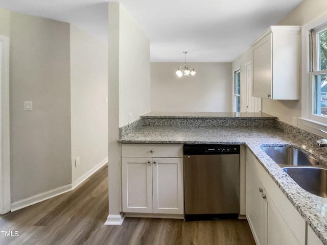 kitchen featuring dishwasher, hardwood / wood-style floors, white cabinetry, and kitchen peninsula