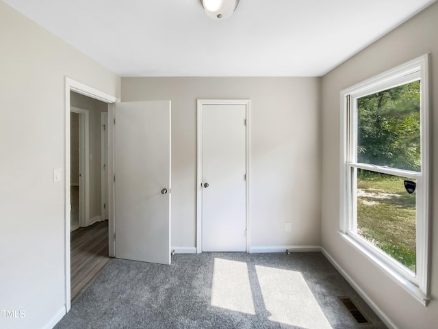 unfurnished bedroom featuring carpet flooring