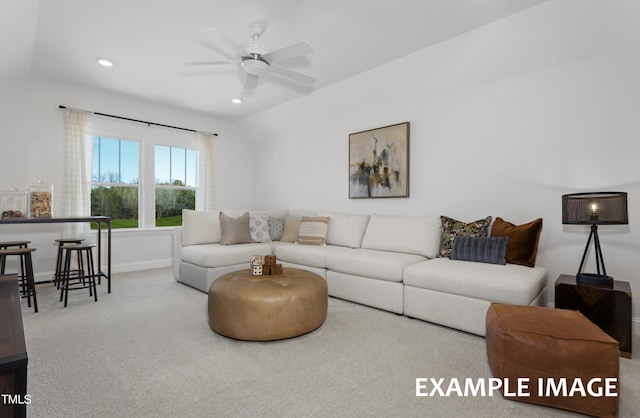 carpeted living room featuring lofted ceiling and ceiling fan