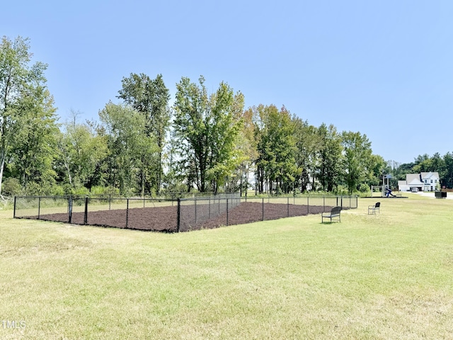 surrounding community featuring a lawn and fence