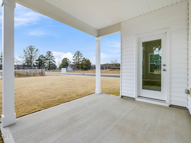 view of patio / terrace featuring fence