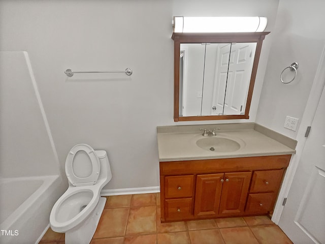 bathroom featuring vanity, tile patterned floors, toilet, and baseboards