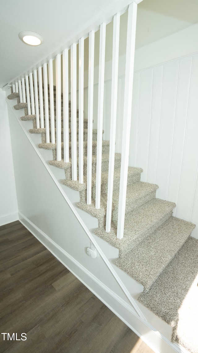 stairs with wood-type flooring