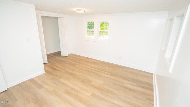 unfurnished room with light hardwood / wood-style flooring