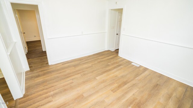 unfurnished room featuring light hardwood / wood-style floors