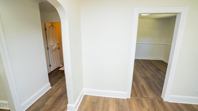 corridor featuring dark hardwood / wood-style flooring