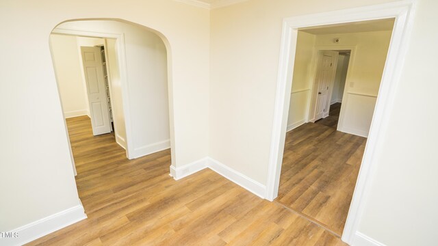 hallway with hardwood / wood-style floors