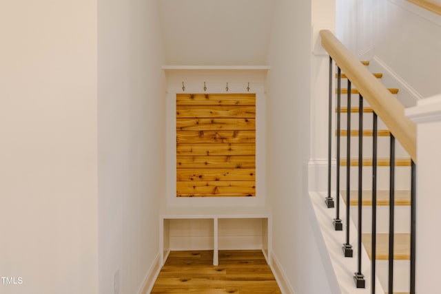 stairs featuring baseboards and wood finished floors