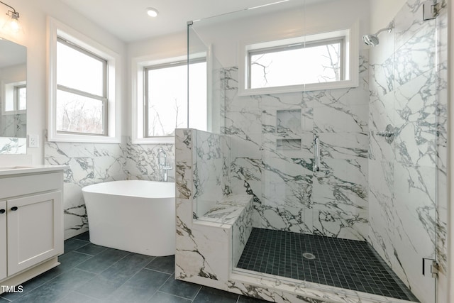 full bath with recessed lighting, a marble finish shower, a soaking tub, and vanity