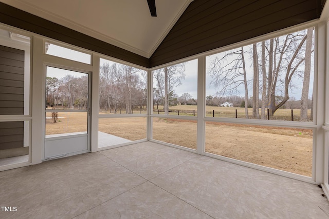 unfurnished sunroom with a wealth of natural light and vaulted ceiling