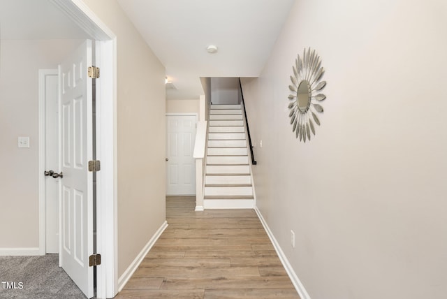 hall with light hardwood / wood-style floors