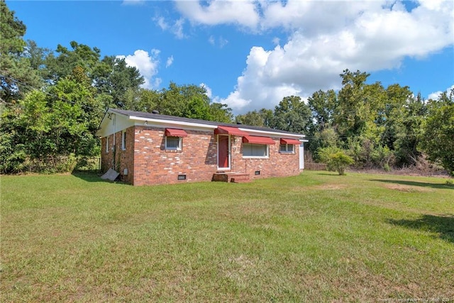 rear view of house with a lawn