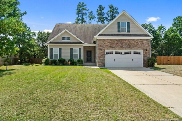 craftsman-style house with a garage and a front yard