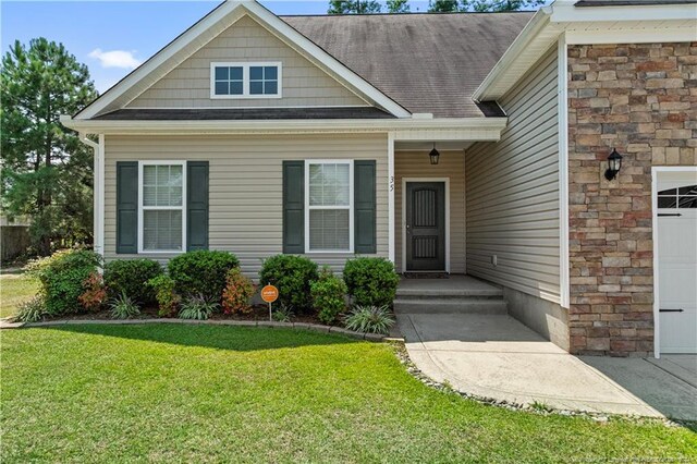 exterior space featuring a front lawn