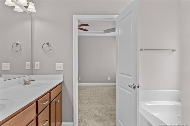 bathroom with ceiling fan and vanity