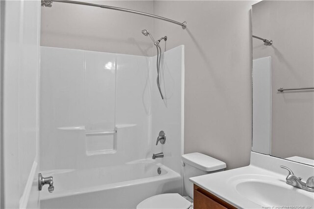 full bathroom with vanity, toilet, and shower / tub combination