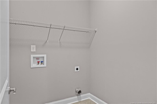 clothes washing area with electric dryer hookup and washer hookup