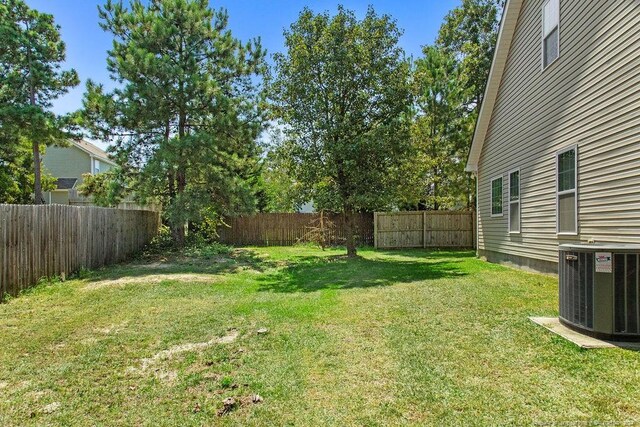 view of yard featuring central AC unit