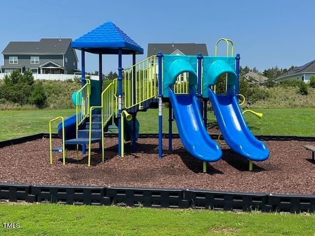 view of playground featuring a lawn