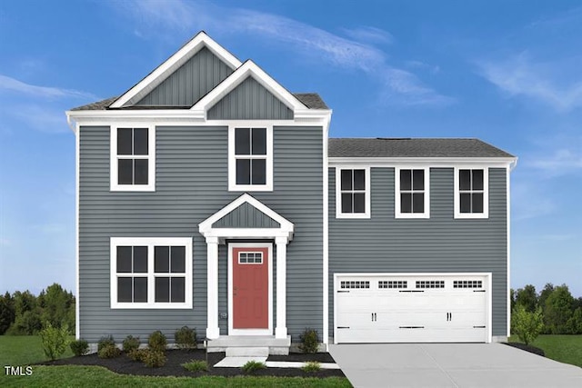 view of front of home with a garage, driveway, and board and batten siding