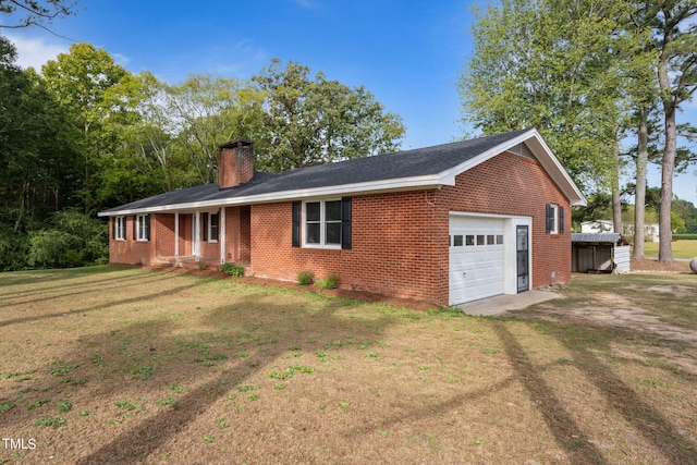 ranch-style house featuring a front lawn and a garage